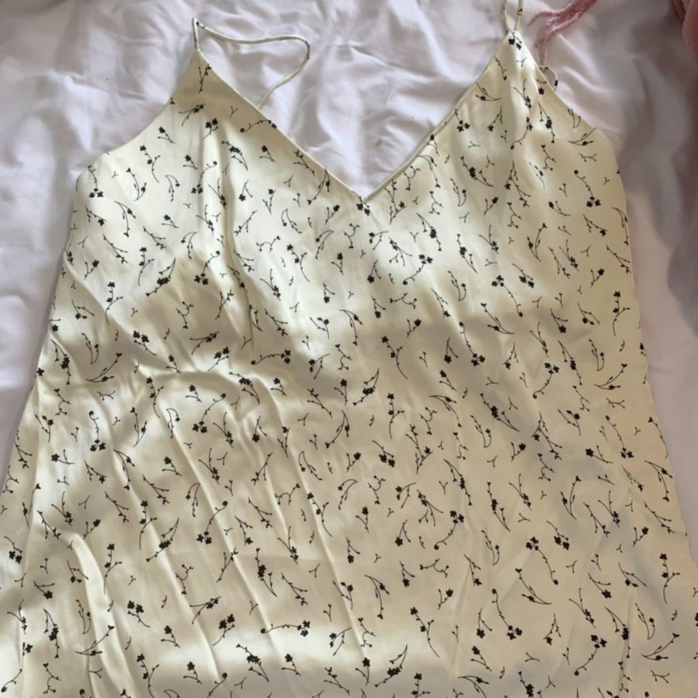 large cream cami top with black floral design